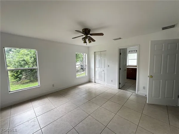 a view of an empty room with a window