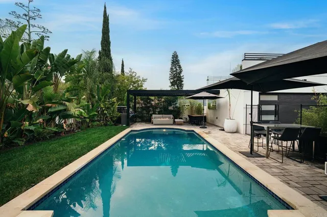 an aerial view of residential houses with outdoor space