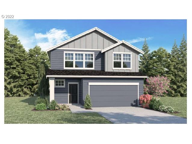 2900 W Street Springfield, OR 97477 - Photo 1 of 2 a front view of a house with a yard and garage