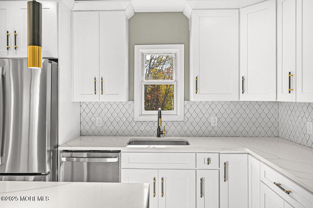 940 Grove Avenue Old Bridge, NJ 08879 - Photo 15 of 48 a kitchen with a sink cabinets and a window