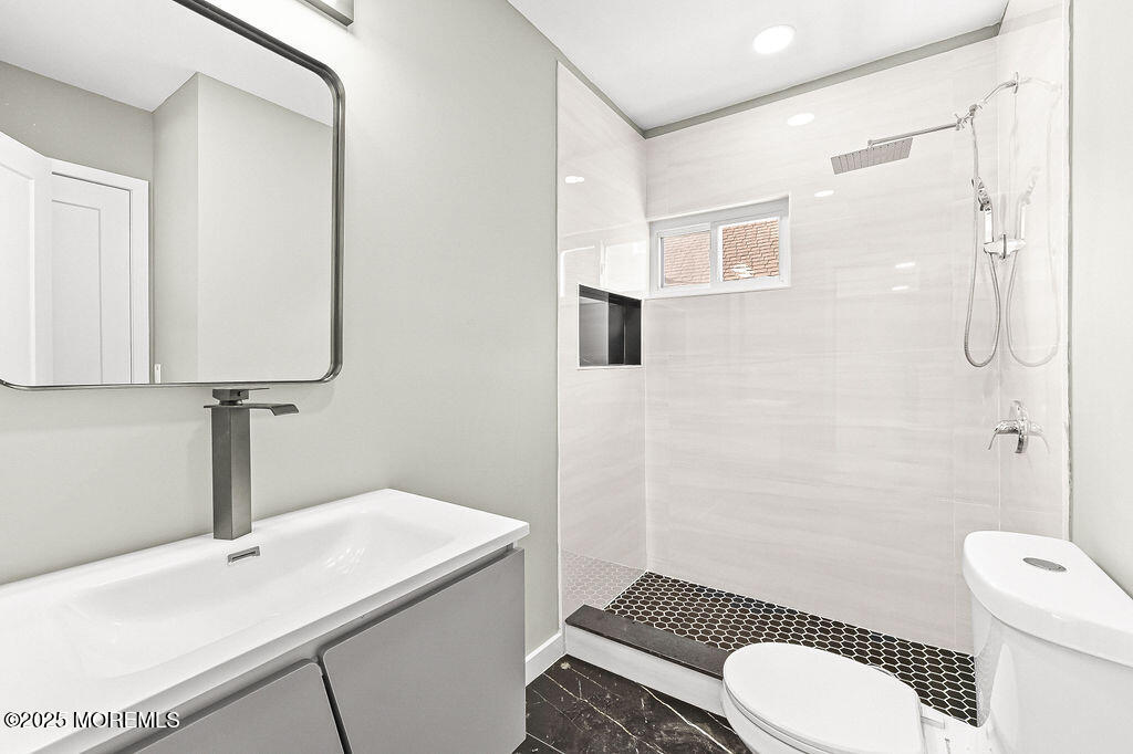 940 Grove Avenue Old Bridge, NJ 08879 - Photo 19 of 48 a bathroom with a sink toilet and shower