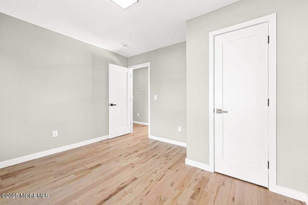 940 Grove Avenue Old Bridge, NJ 08879 - Photo 26 of 48 a view of an empty room with wooden floor