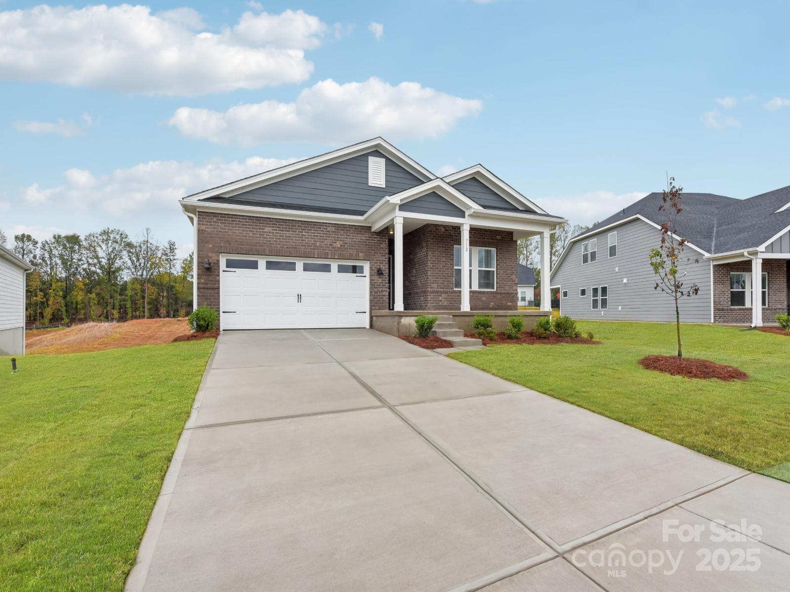 712 Palmer Pendleton Way York, SC 29745 - Photo 34 of 36 a front view of a house with yard