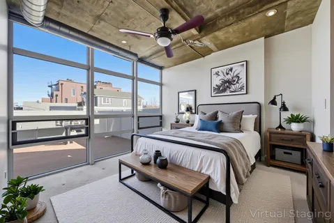 a bed room with a bed and a chandelier