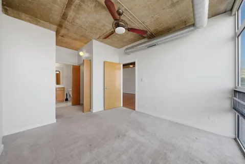 a view of an empty room and a window