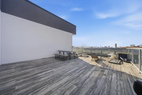 a view of a terrace with chairs