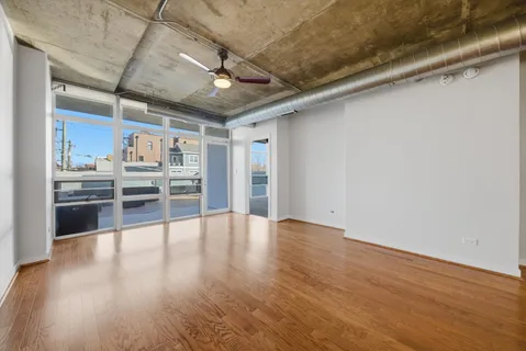 a view of a kitchen with wooden floor