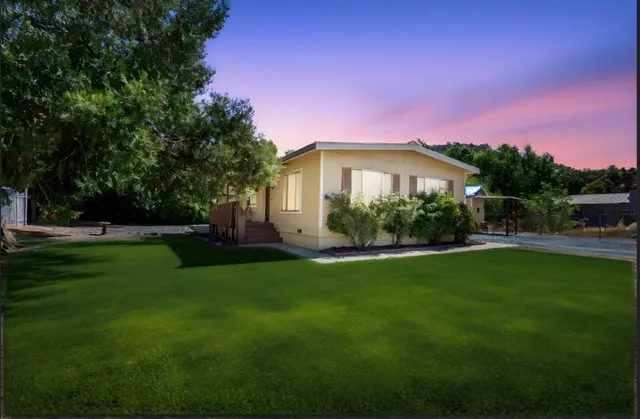 a view of a house with a big yard