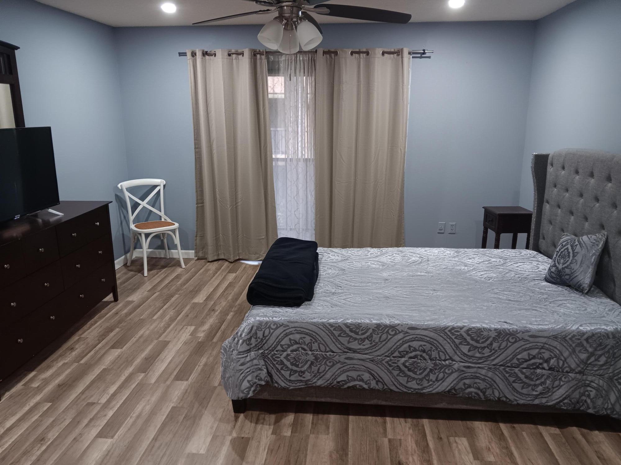 12989 Odessa Trail, Unit 3 Wellington, FL 33414 - Photo 15 of 32 a bedroom with a bed and wooden floor