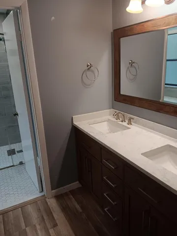a bathroom with a sink toilet and shower