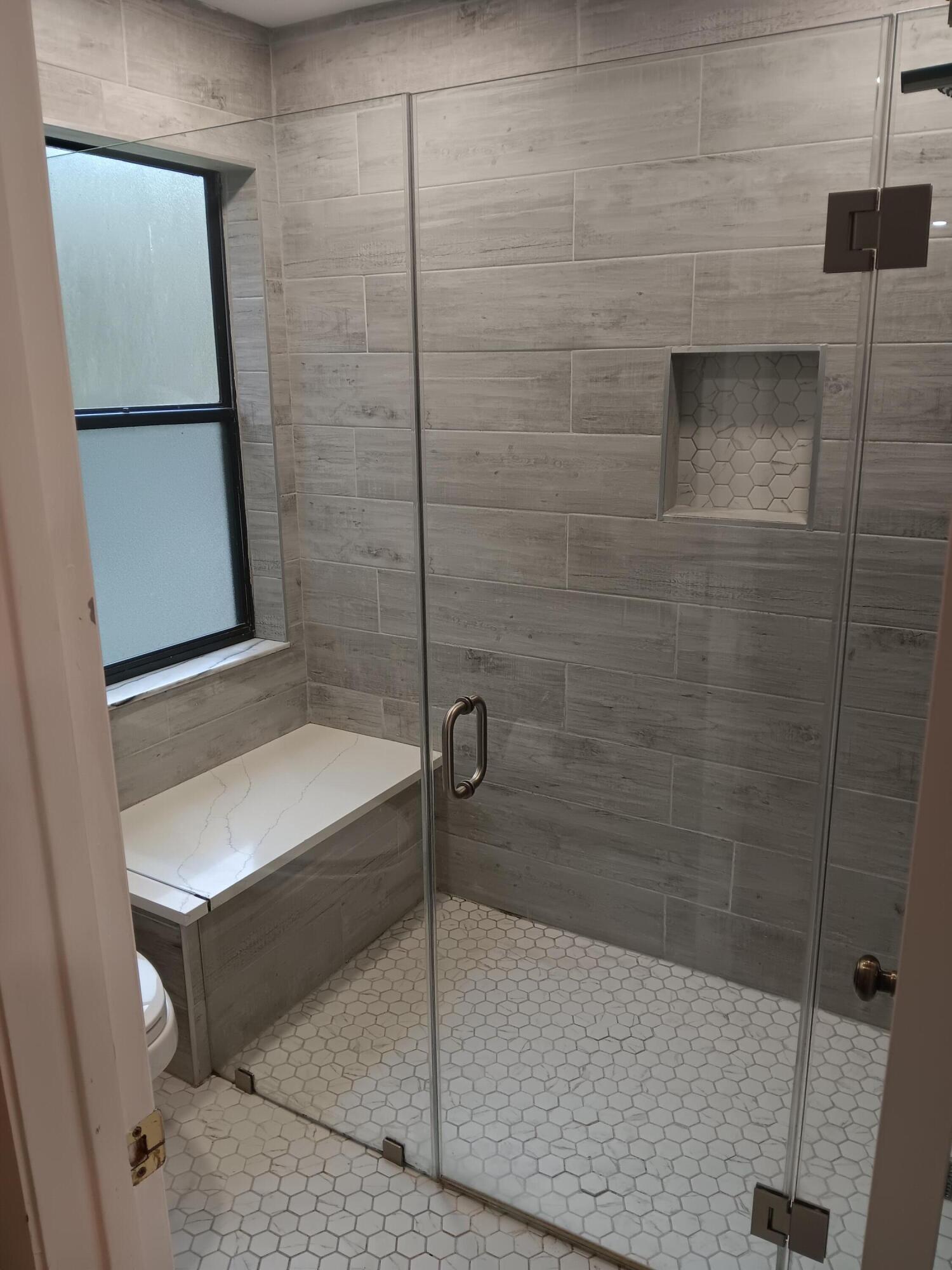 12989 Odessa Trail, Unit 3 Wellington, FL 33414 - Photo 19 of 32 a bathroom with a bathtub