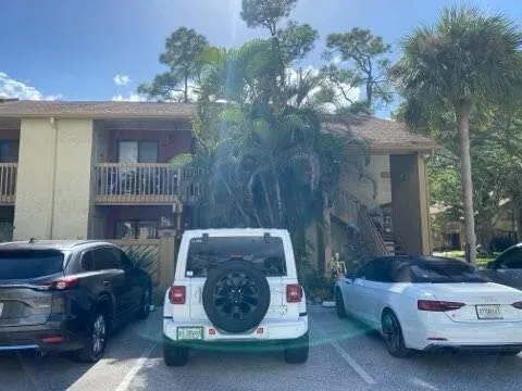 a backyard of a house with outdoor seating