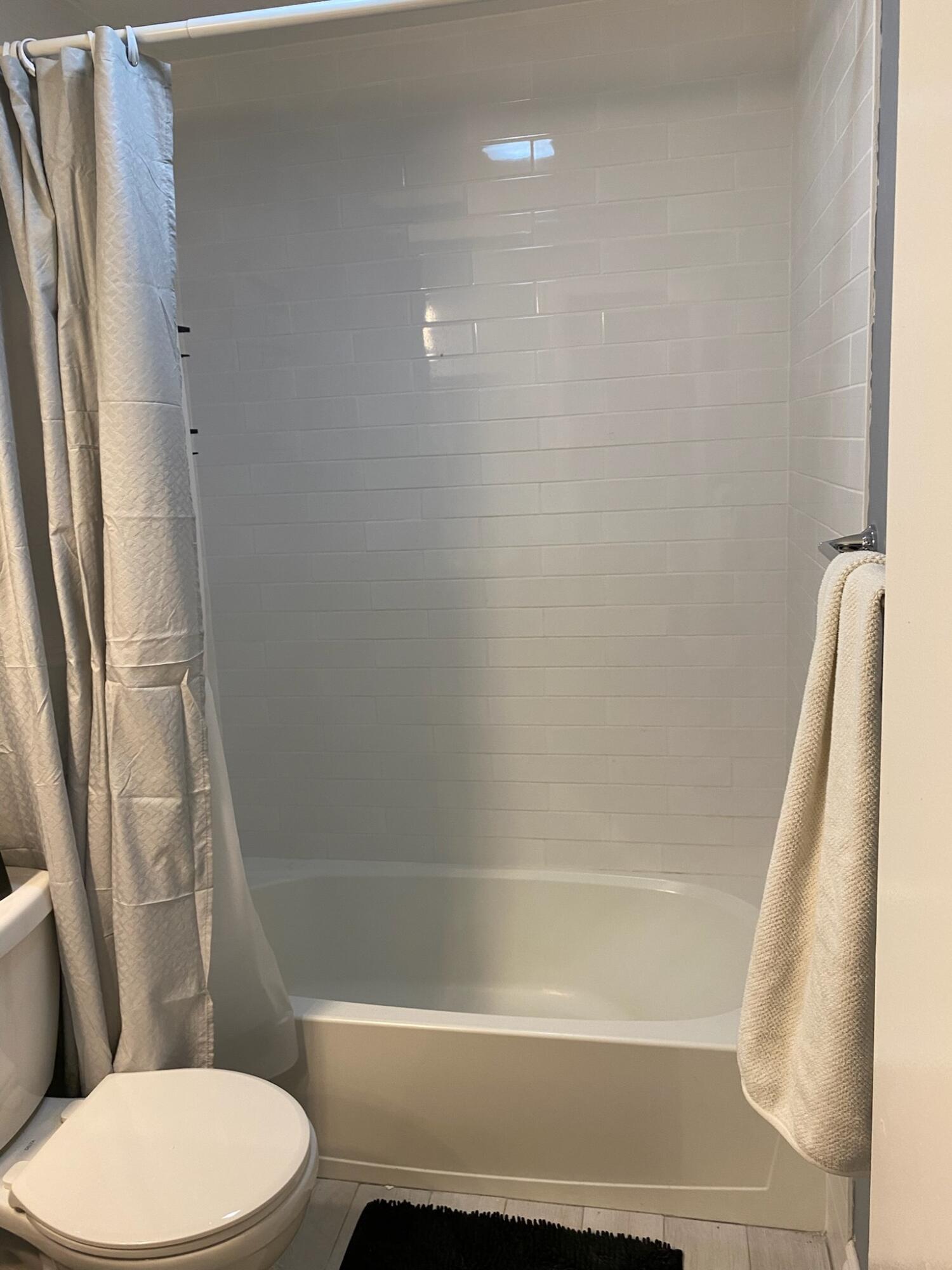 12989 Odessa Trail, Unit 3 Wellington, FL 33414 - Photo 23 of 32 a bathroom with a toilet and a shower