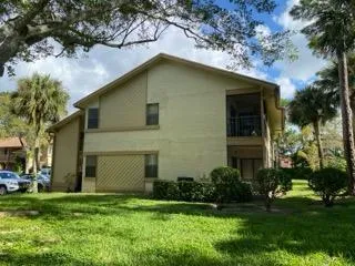 a view of a swimming pool with a yard