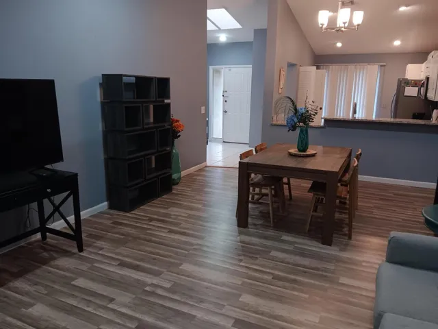 a kitchen with stainless steel appliances cabinets and a refrigerator