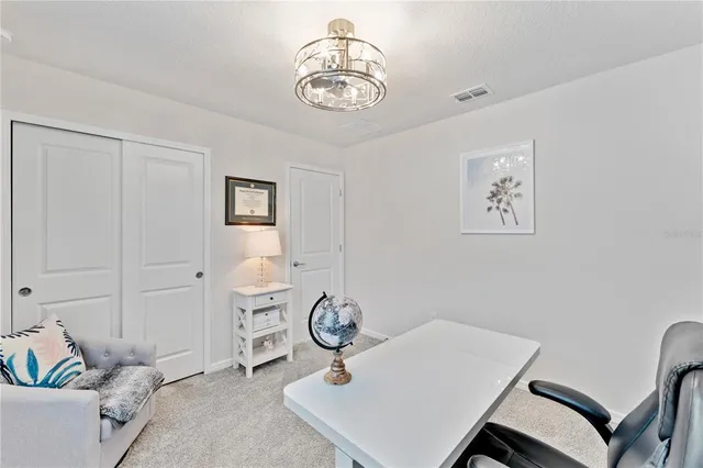 a view of storage and utility room with racks on the wall