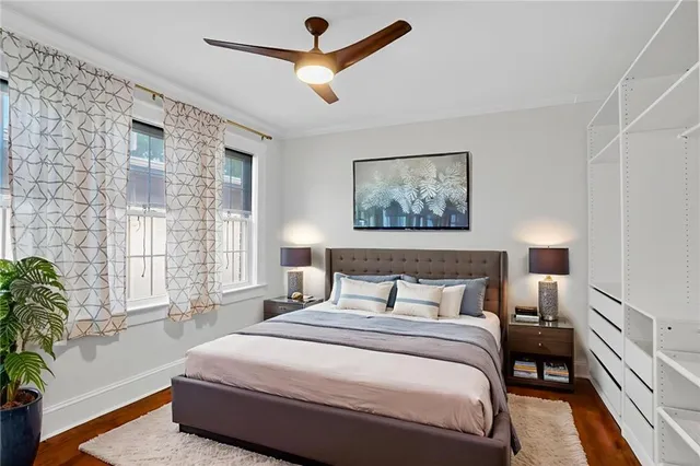 a bedroom with a large bed and a window