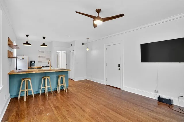 a view of a dining room with furniture and wooden floor