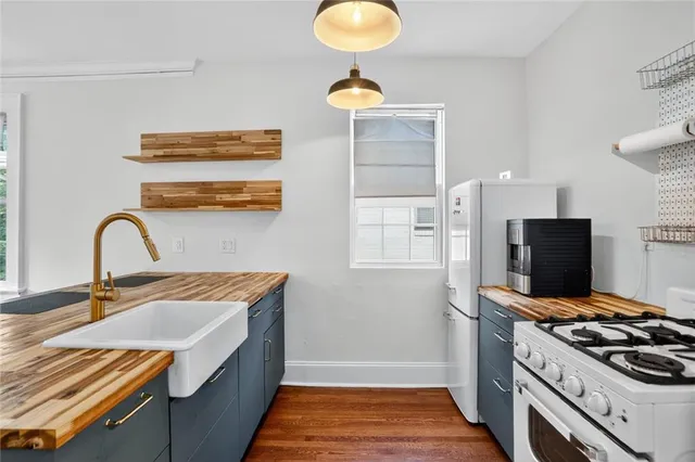 a kitchen with a stove and a sink