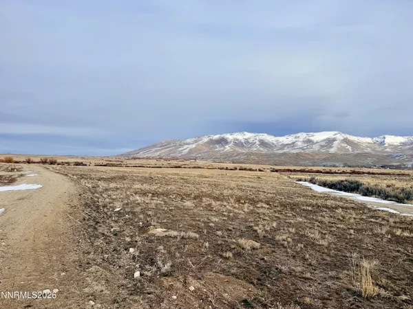 a view of an ocean with a mountain