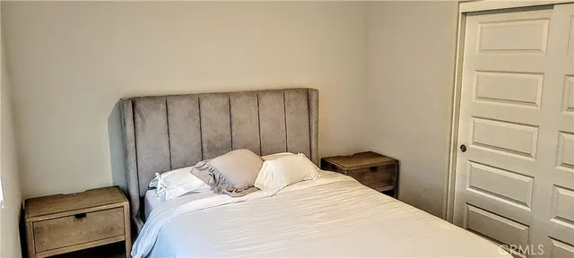 a bedroom with a bed and a cabinets