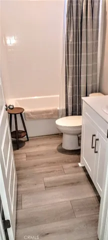 a bathroom with a bathtub and a sink