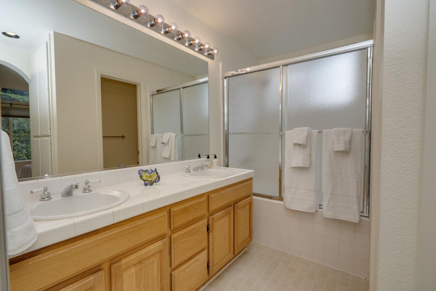 120 Patrick Way Half Moon Bay, CA 94019 - Photo 14 of 22 a bathroom with a sink double vanity and a mirror