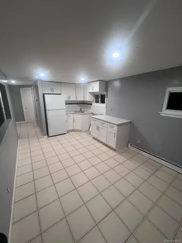 a room with a bed and a view of couch