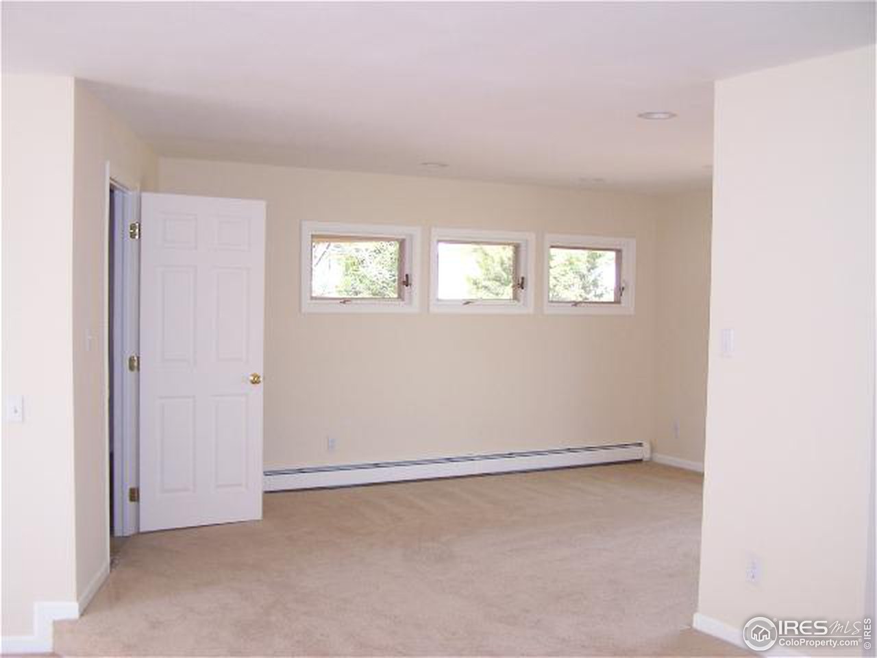 8747 Baseline Road Lafayette, CO 80026 - Photo 8 of 12 a view of an empty room with a window