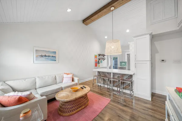 a kitchen with stainless steel appliances a refrigerator sink and microwave