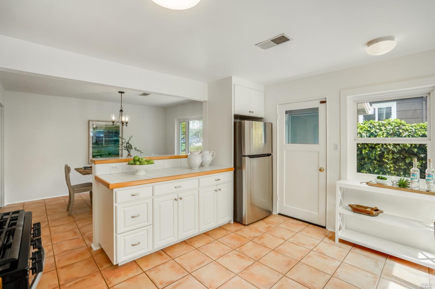 78 Nelson Avenue Mill Valley, CA 94941 - Photo 17 of 21 a room with a sink and a large mirror