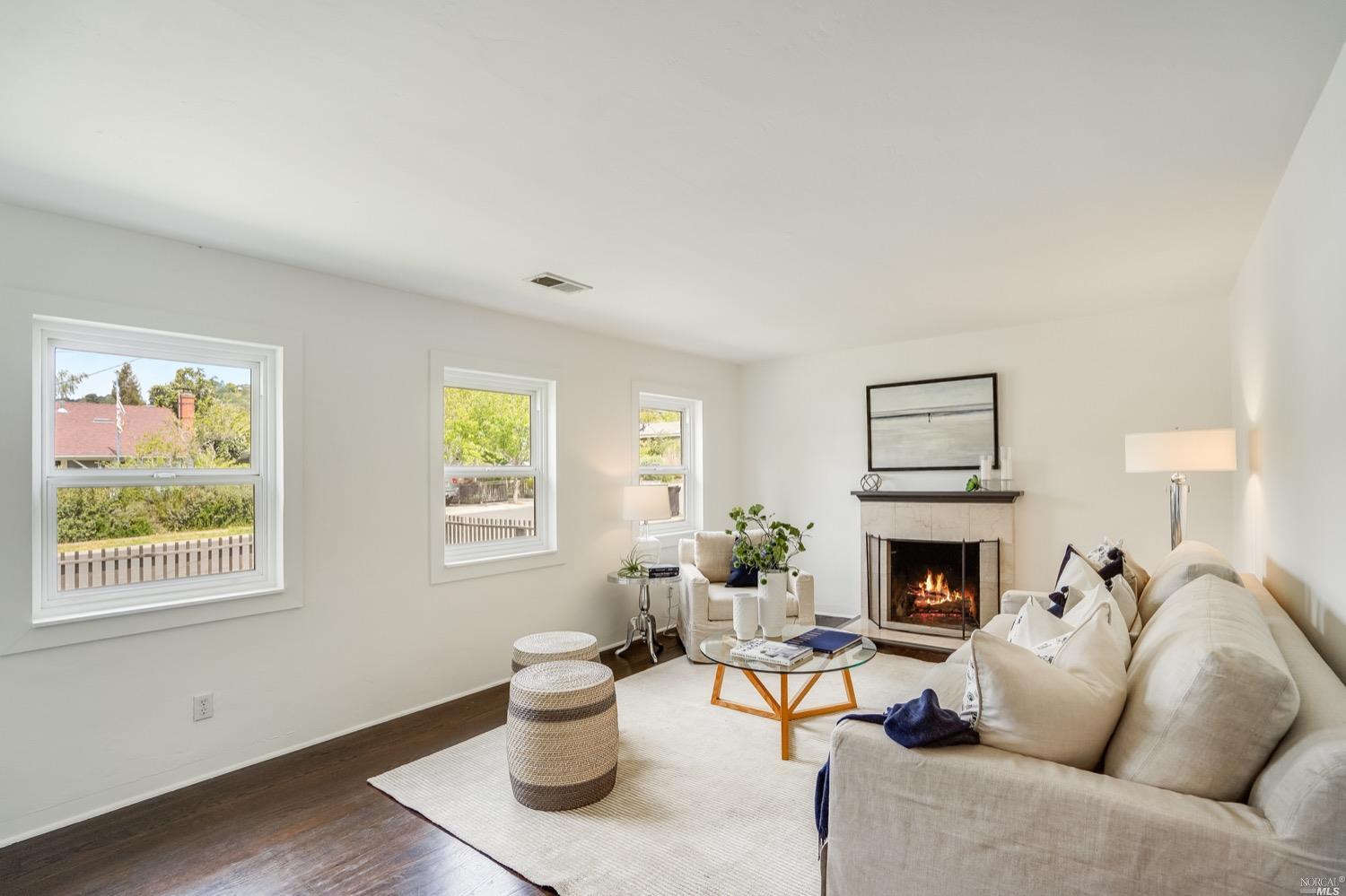 78 Nelson Avenue Mill Valley, CA 94941 - Photo 5 of 21 a living room with furniture and a fireplace