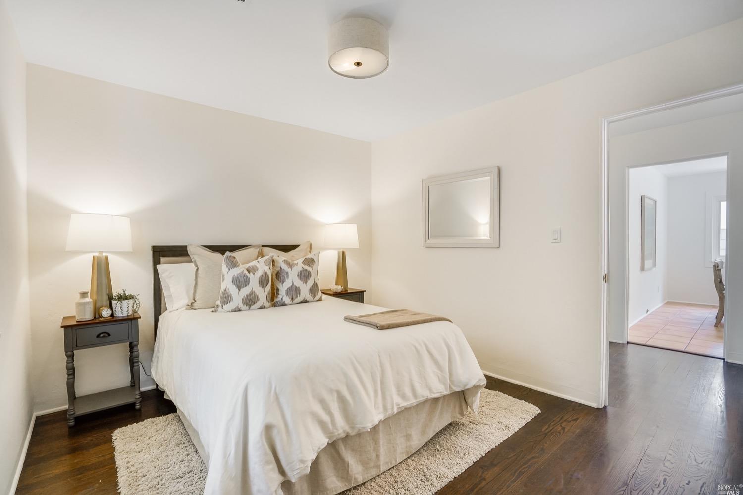 78 Nelson Avenue Mill Valley, CA 94941 - Photo 9 of 21 a bedroom with a bed and wooden floor