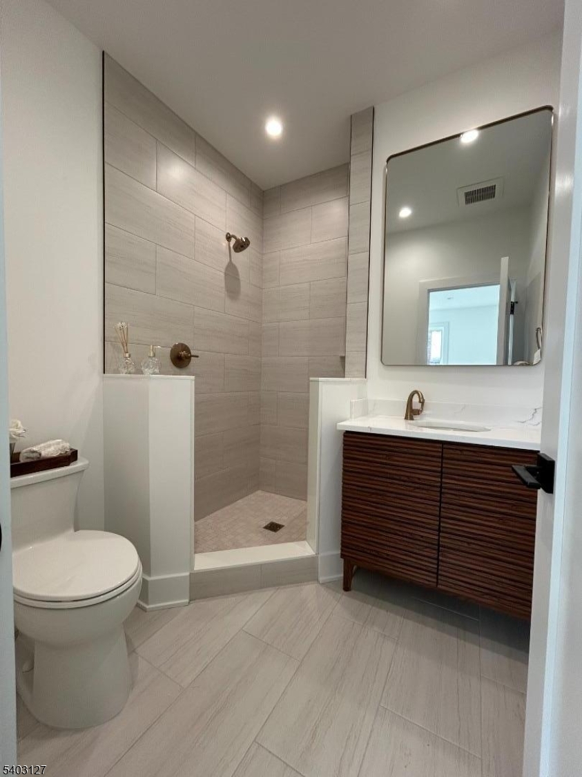 1225 Morris Avenue, Unit 204 Union, NJ 07083 - Photo 7 of 12 a bathroom with a sink a toilet and shower