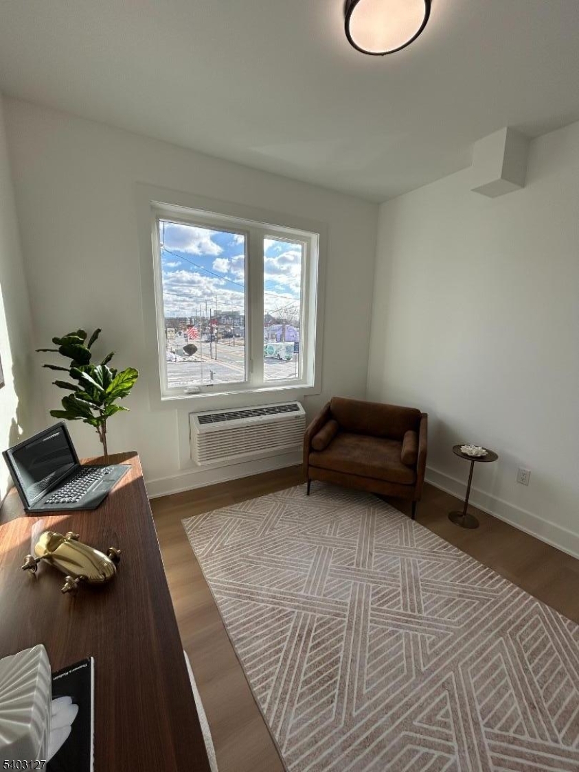 1225 Morris Avenue, Unit 204 Union, NJ 07083 - Photo 9 of 12 a living room with furniture and a window