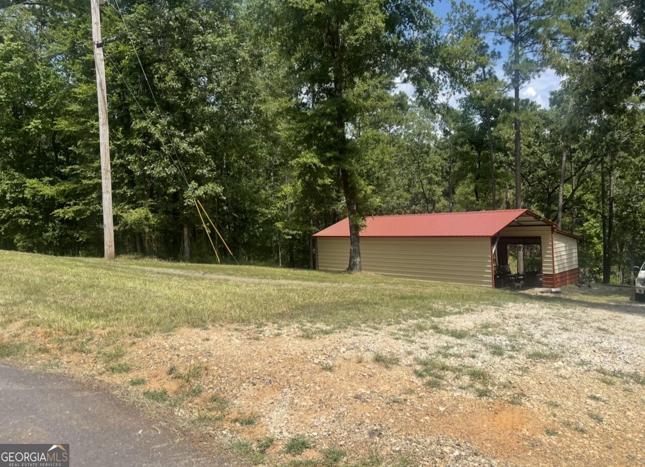 333 Venture Trail Sparta, GA 31087 - Photo 5 of 16 a view of a yard with a house