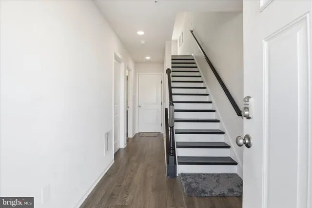 a view of entryway with wooden floor