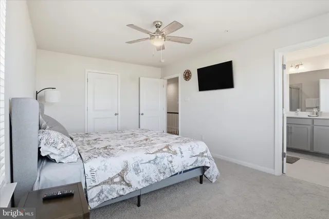 a bedroom with a bed and a tv