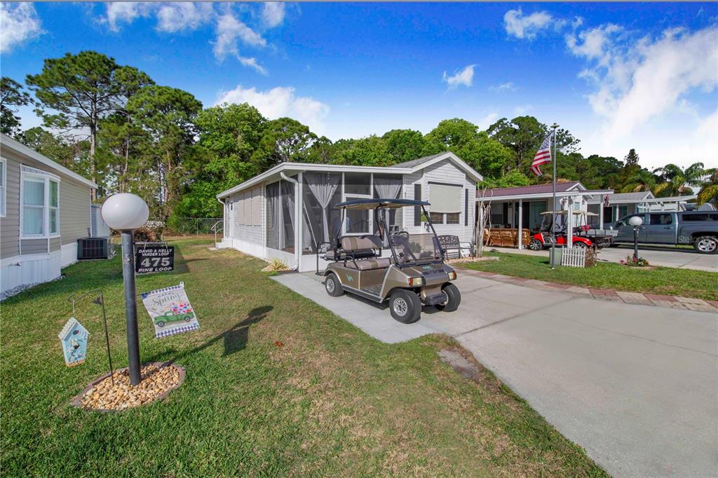 475 Pine Loop Frostproof, FL 33843 - Photo 2 of 40 a view of a house with backyard porch and sitting area