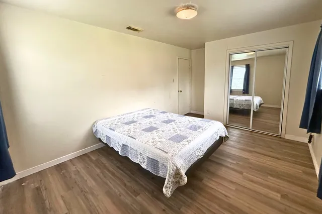 a bedroom with a bed and a table