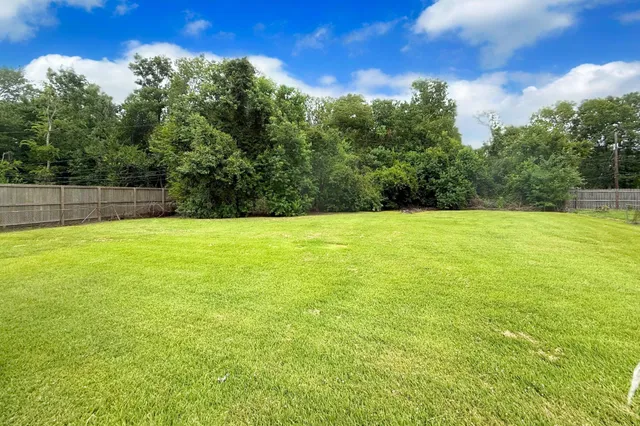 a view of a swimming pool with an outdoor space and seating area