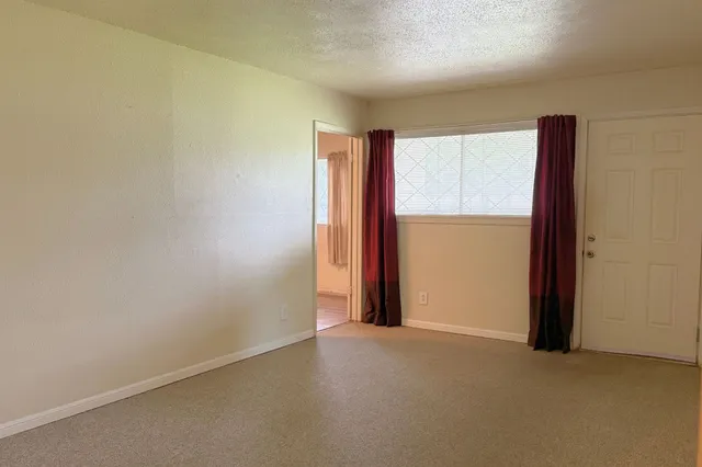 an empty room with closet area