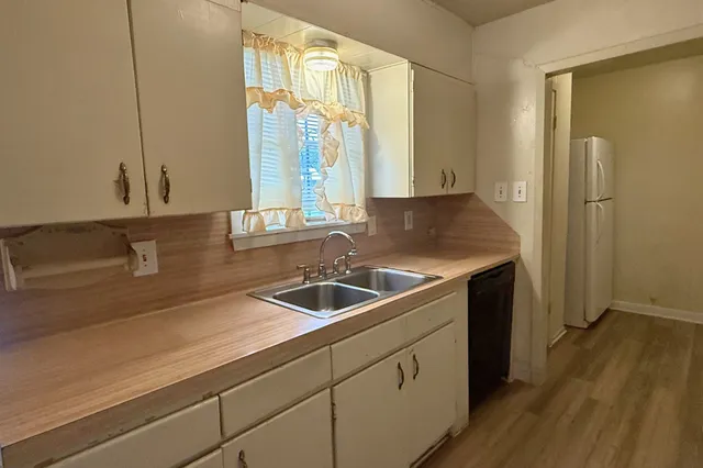 a kitchen with a sink and a window