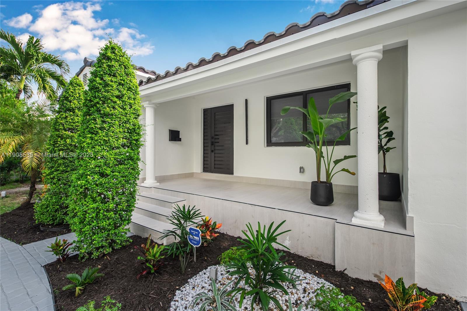 1244 Southwest 14th Street Miami, FL 33145 - Photo 4 of 63 a front view of a house with garden