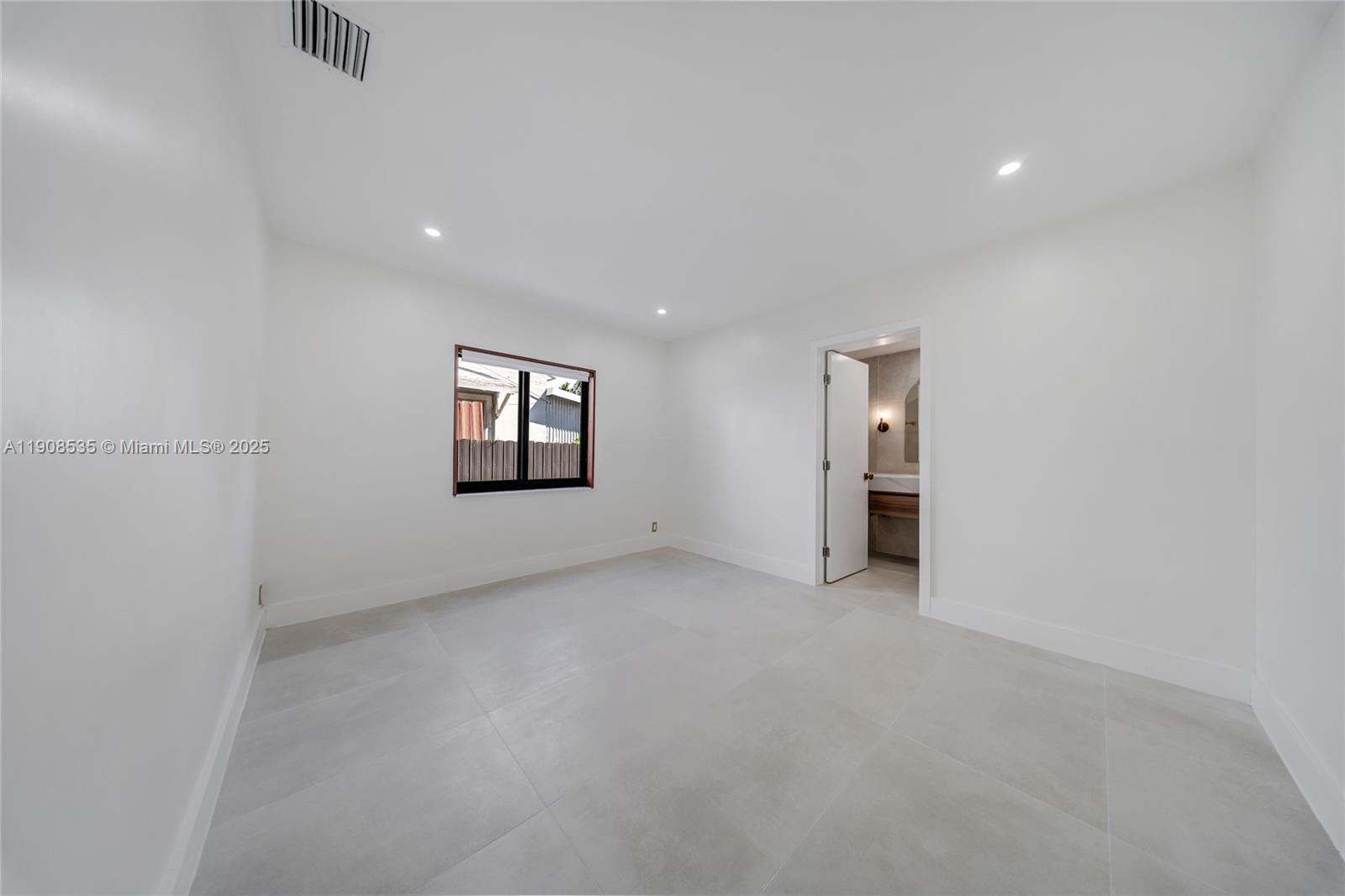 1244 Southwest 14th Street Miami, FL 33145 - Photo 42 of 63 an empty room with closet and windows
