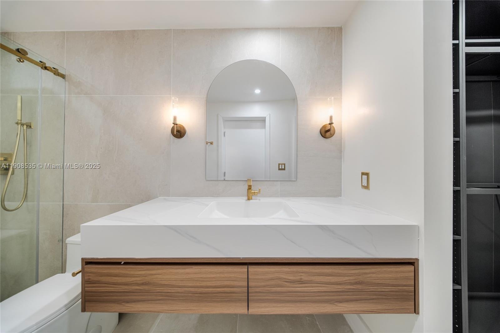 1244 Southwest 14th Street Miami, FL 33145 - Photo 43 of 63 a bathroom with a sink and a mirror