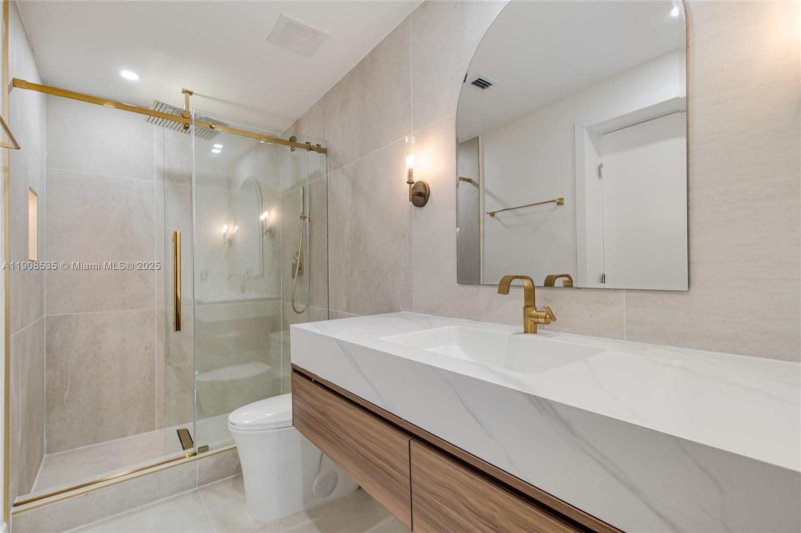 1244 Southwest 14th Street Miami, FL 33145 - Photo 44 of 63 a bathroom with a sink a toilet and shower