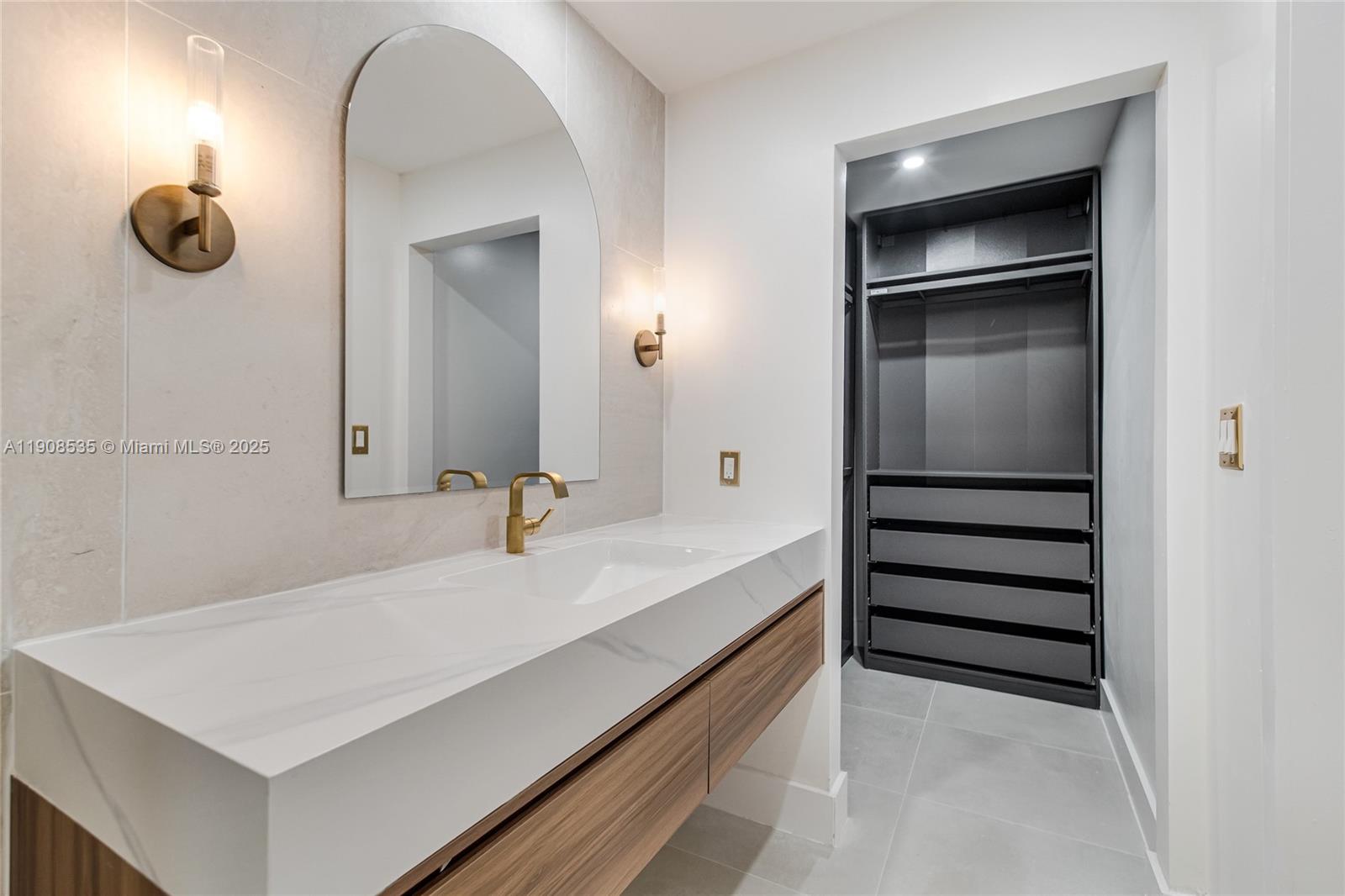 1244 Southwest 14th Street Miami, FL 33145 - Photo 46 of 63 a bathroom with a sink a toilet and mirror