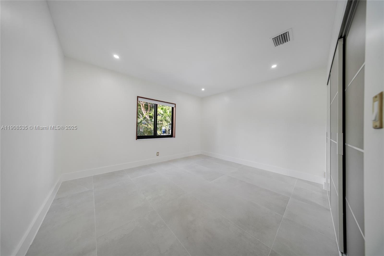 1244 Southwest 14th Street Miami, FL 33145 - Photo 48 of 63 a view of an empty room with a window