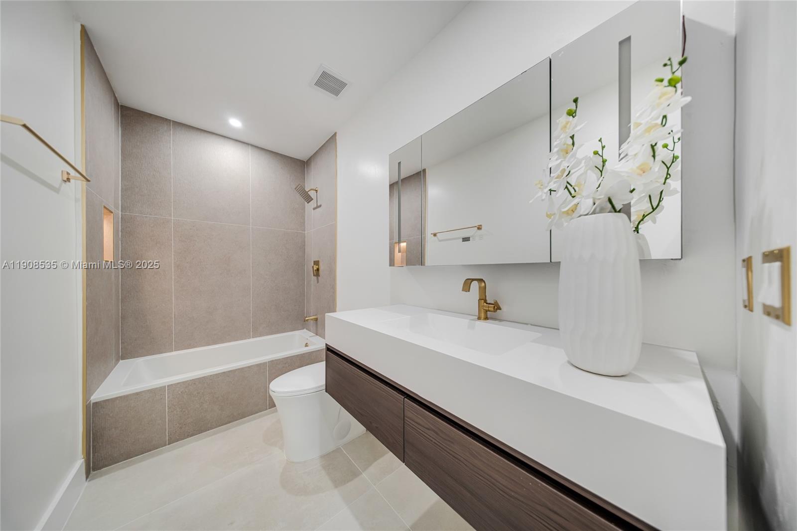 1244 Southwest 14th Street Miami, FL 33145 - Photo 49 of 63 a bathroom with a sink and a mirror